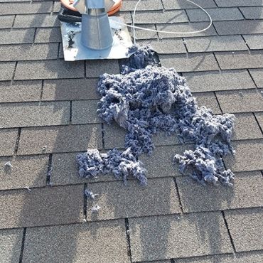 Dryer vent cleaning - lint on rooftop dryer vent